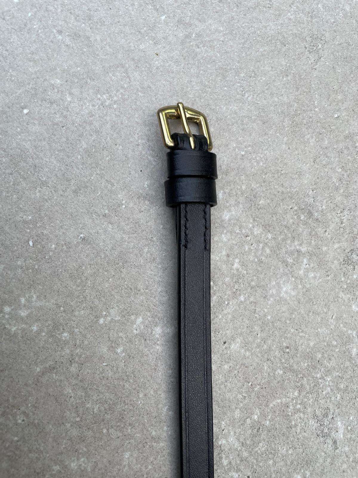 Sperriem zwart, Goude gesp